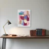 ClassicPlainz Sweet Mix 12x16 Abstract art Canvas placed above a wooden desk, on a white-grey wall in a room.