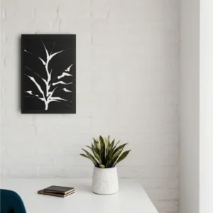 ClassicPlainz Sprouting Roots black and white abstract framed wall art decor hanging on a plain white wall above a desk with some ornaments on the desk